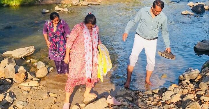 The health department team reached on foot after crossing the river and stream.
