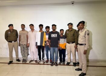 He was forcing people to sign land documents by holding them hostage; the police surrounded and arrested the accused.