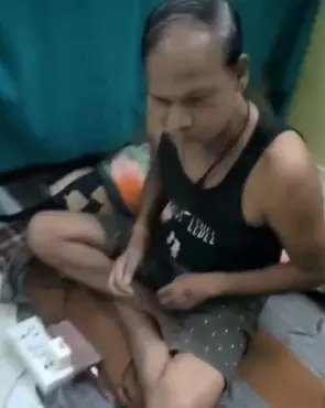 A video of an officer wearing only a vest and drinking alcohol in a government office went viral and he has now been suspended.